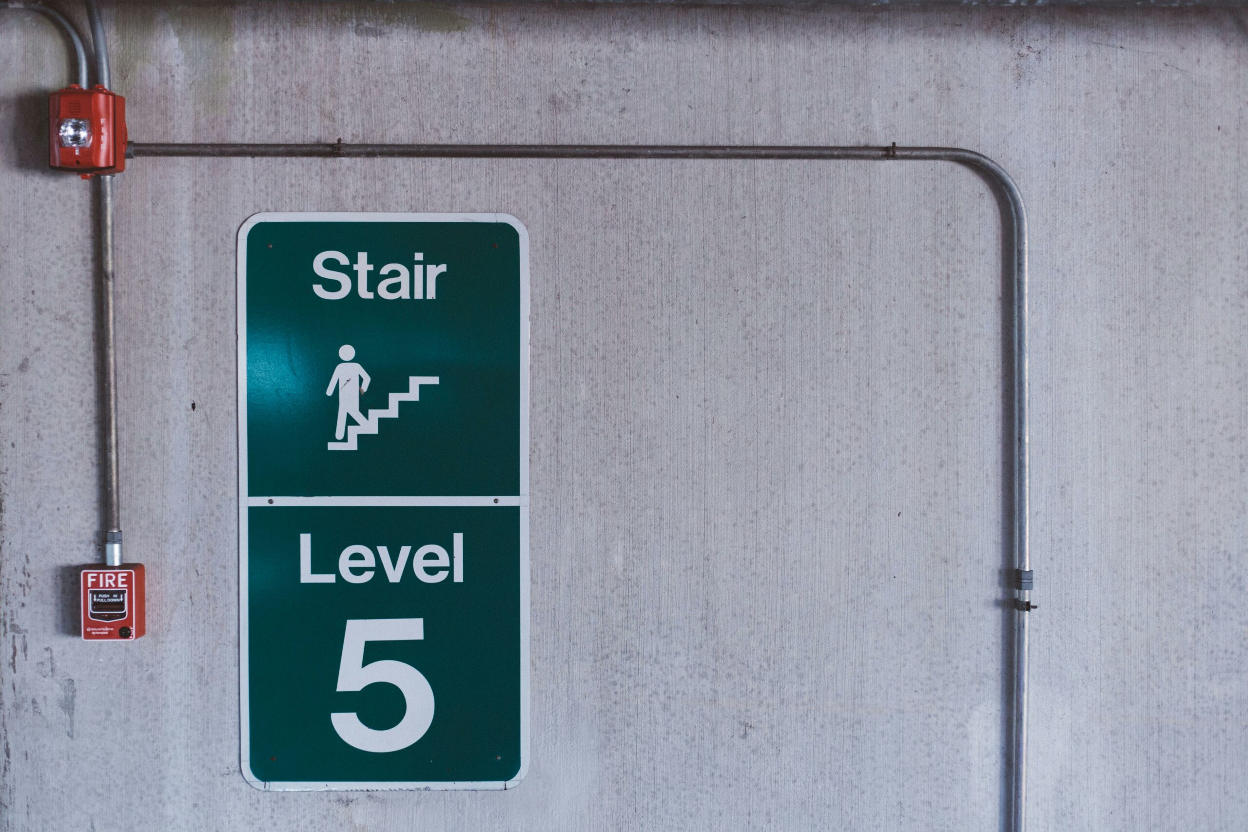 fire escape signs in a building used to maintain employee safety in an emergency